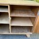 Vintage 1950s oak enfilade buffet with tapered legs.