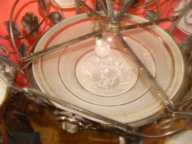 four-armed wrought iron chandelier from the "Art Deco" period (1925)