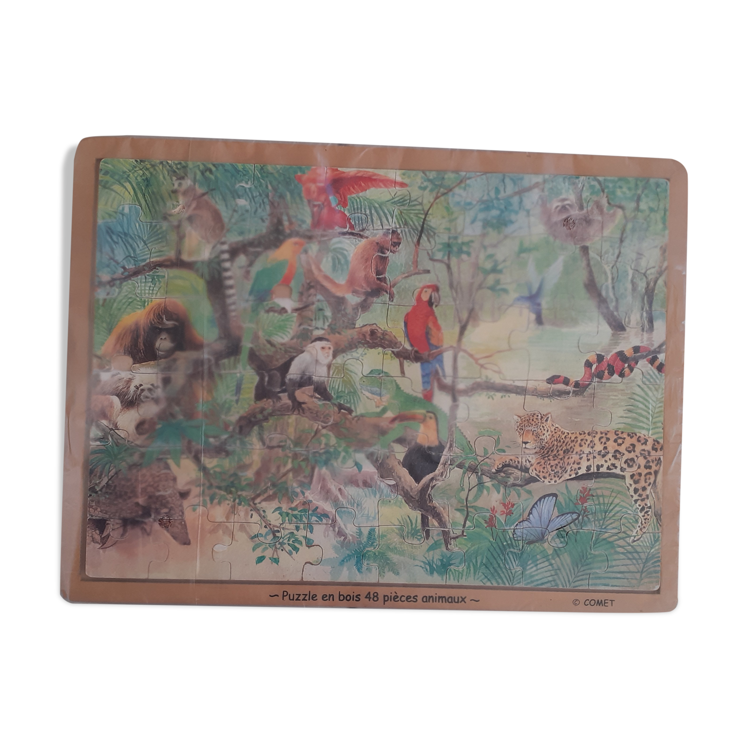 Wooden puzzle. Comet. Pattern jungle animals.