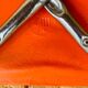 Vintage orange faux leather stool with chrome legs from the 1970s.