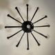 Venetian chandelier in Murano glass in black and colourless, 12 light arms, circa 1990.