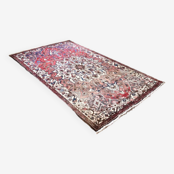 Antique woven wool rug with oriental pattern