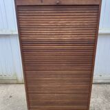 Oak two-column filing cabinet with curtains.