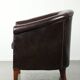 Dark cow leather club armchair with a stylish design in English style