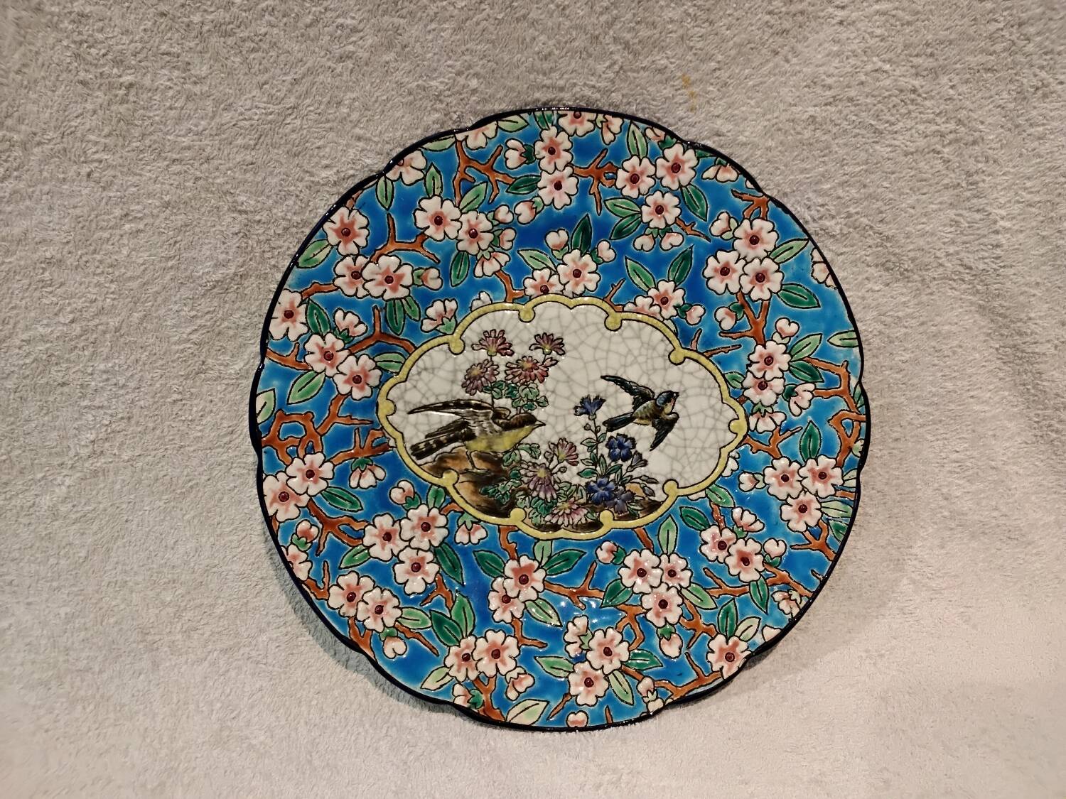 Longwy enamel plate with cartouche of 2 birds and apple blossoms, d188