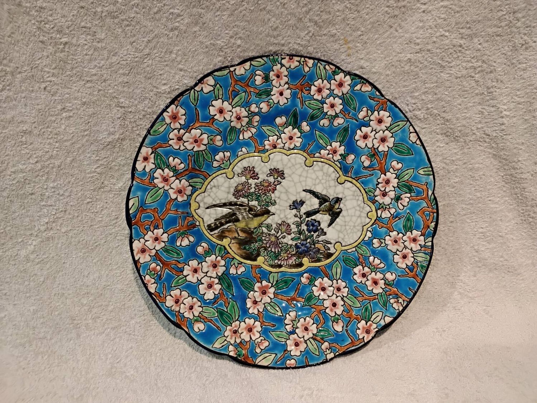 Longwy enamel plate with cartouche of 2 birds and apple blossoms, d188
