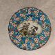 Longwy enamel plate with cartouche of 2 birds and apple blossoms, d188