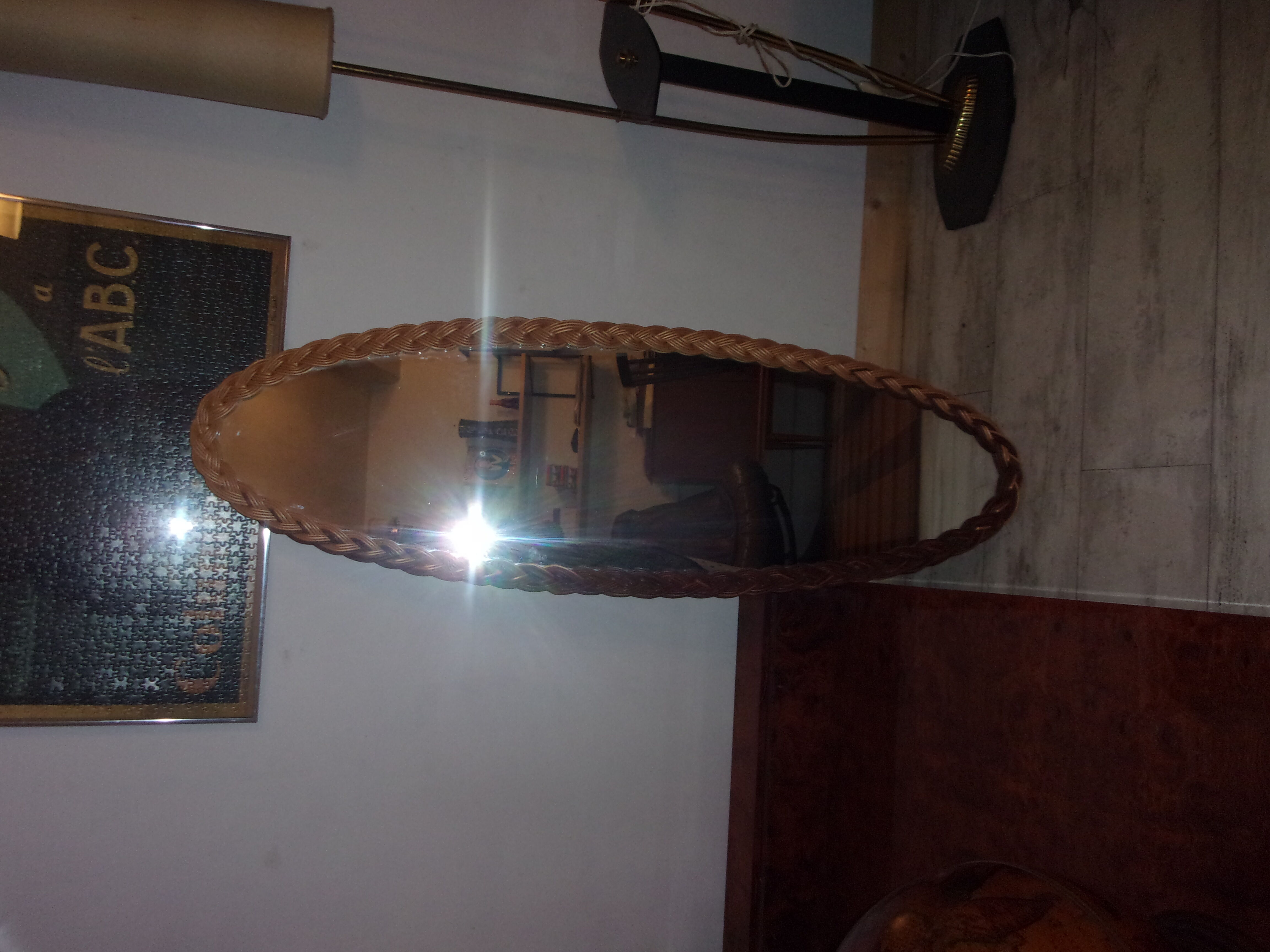 Oval-style rattan mirror