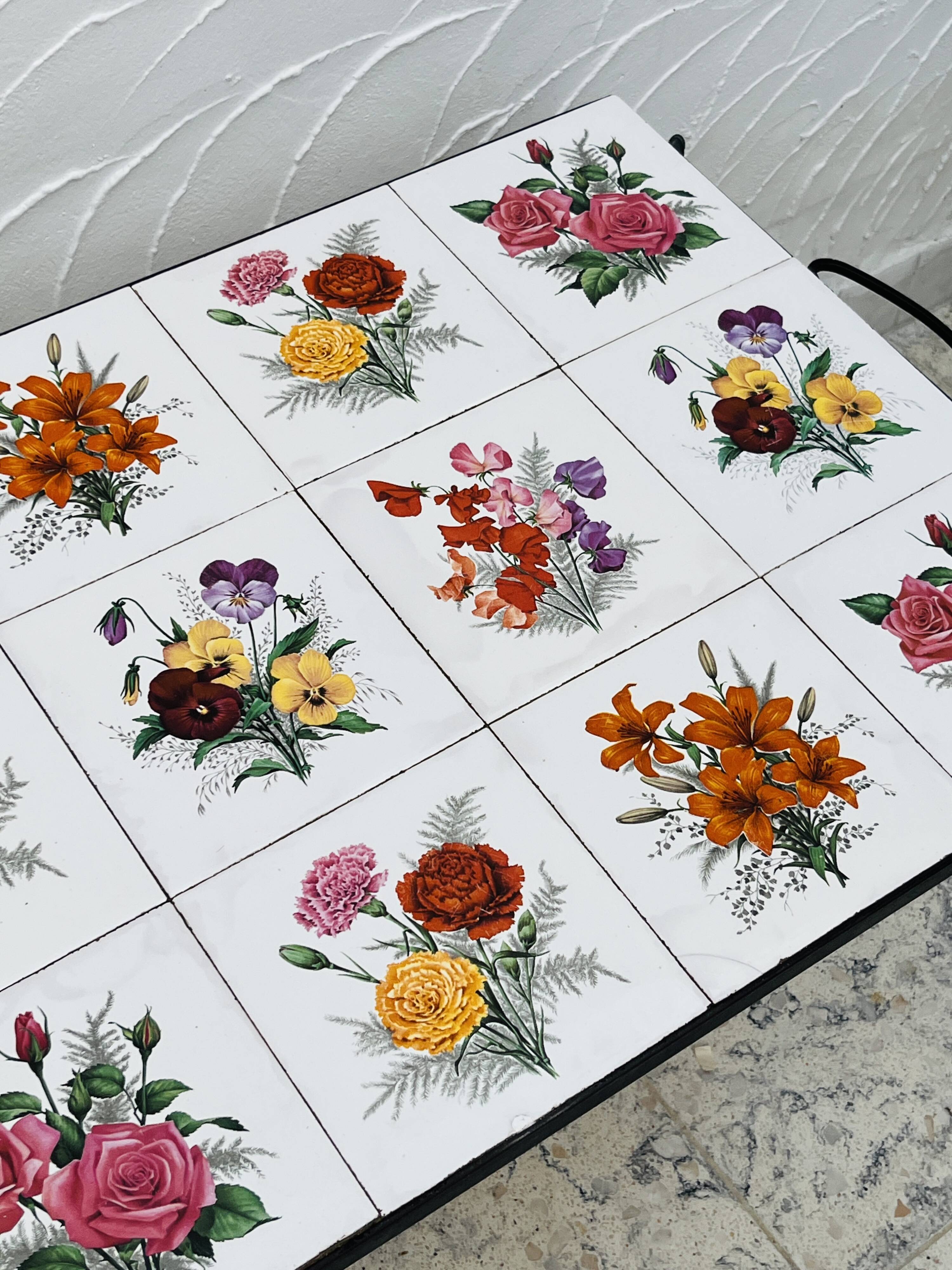 Vintage coffee table in wrought iron with floral tiles.
