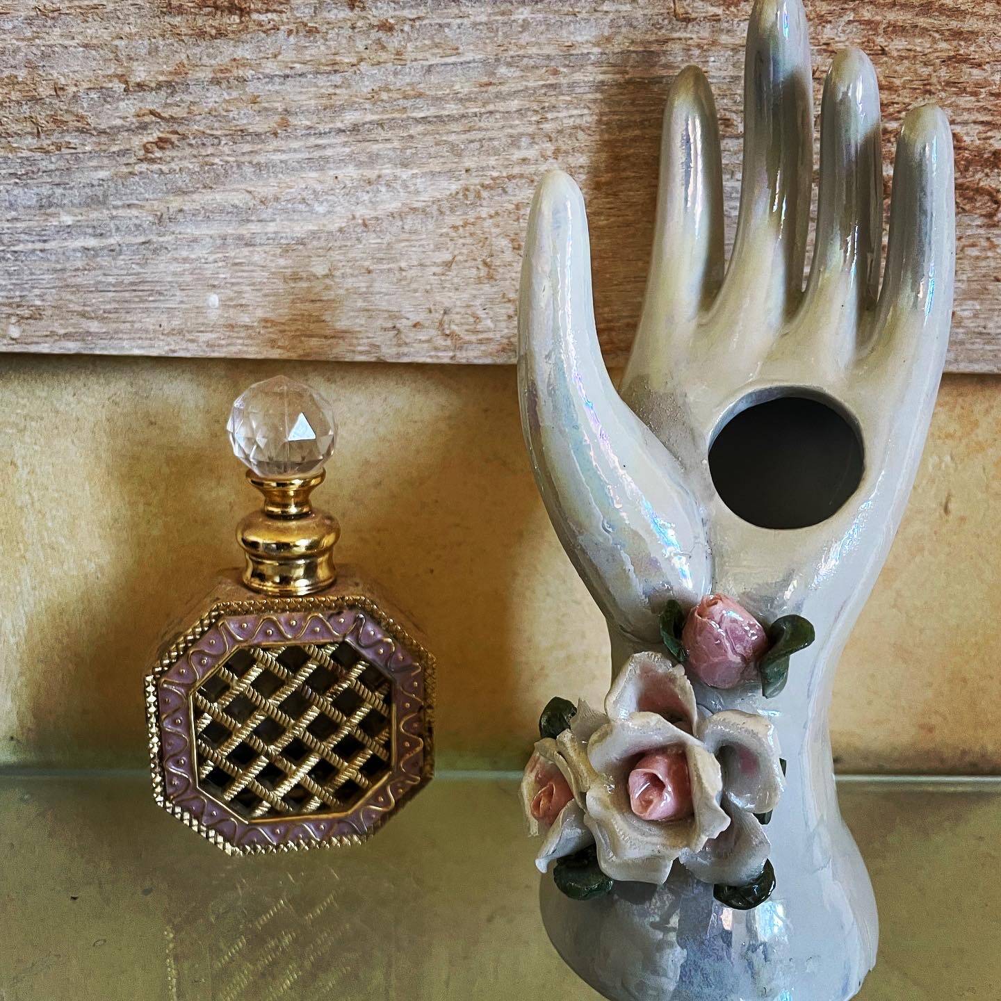 Hand holds jewelry or soliflore