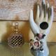 Hand holds jewelry or soliflore