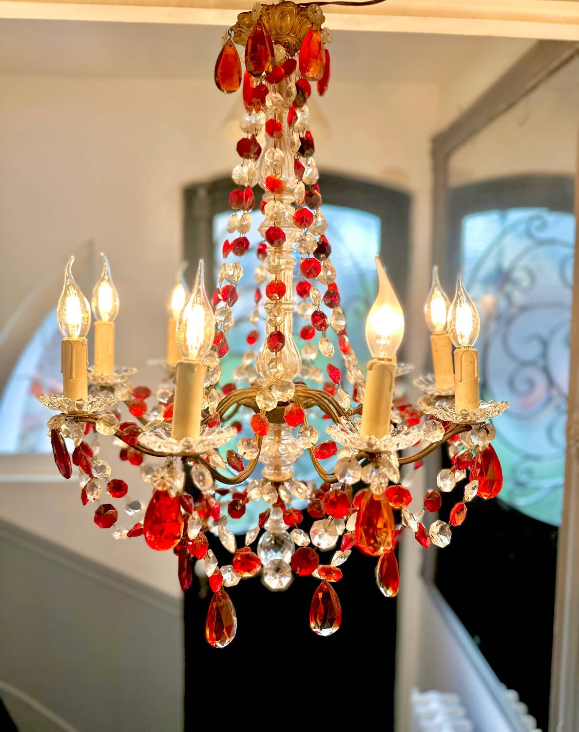 Antique chandelier with red crystal pendants, 9 lights.