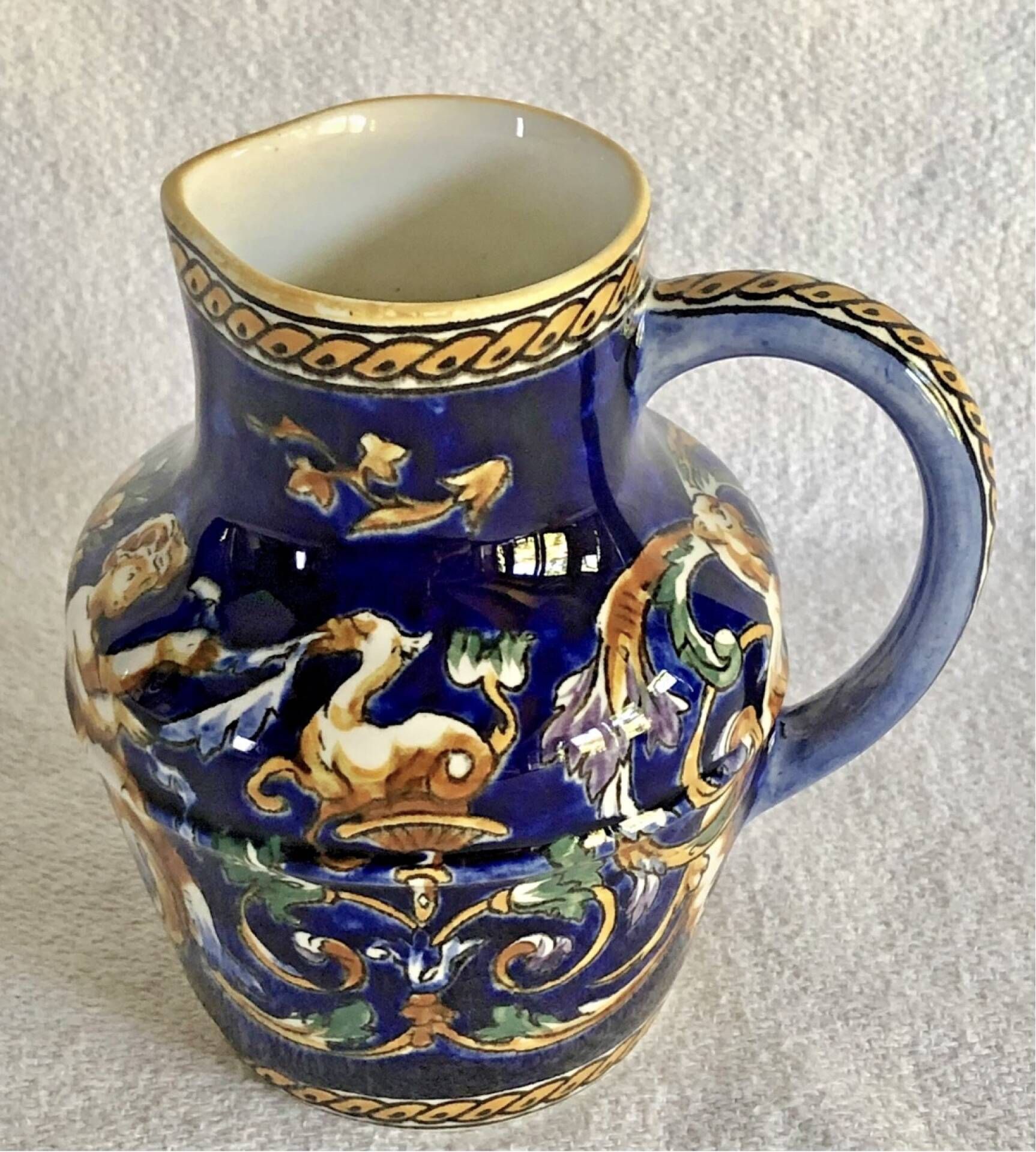 Old cream jug Gien Renaissance blue background 1938/1960