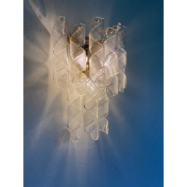 A pair of contemporary transparent “ricci” murano glass wall sconces