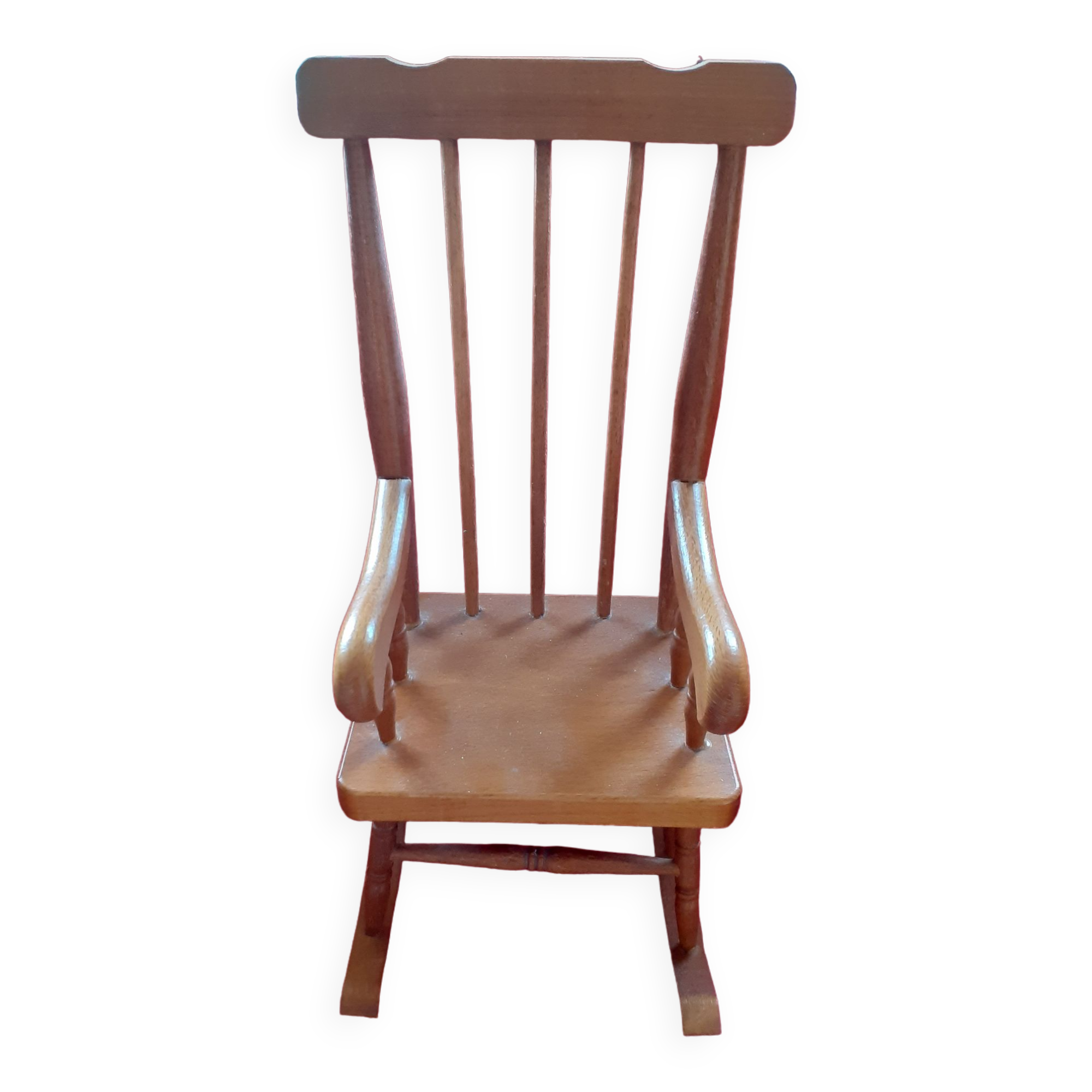 Toy wooden rocking chair.