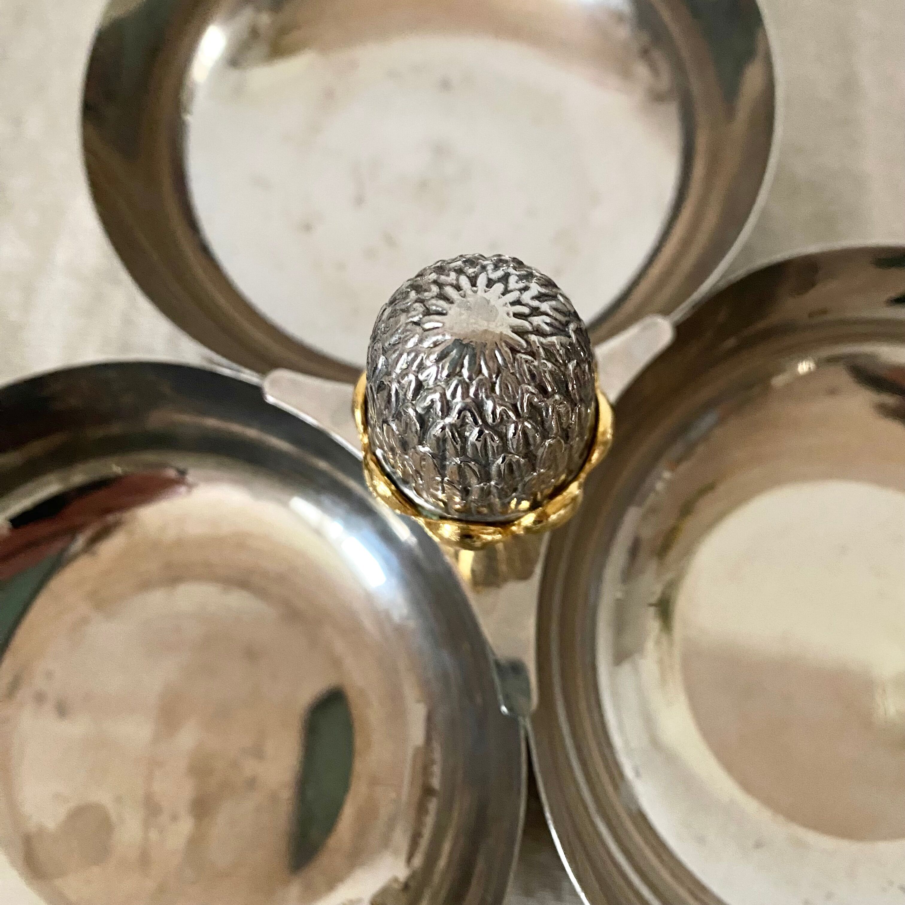 Servant in silver metal pine cone