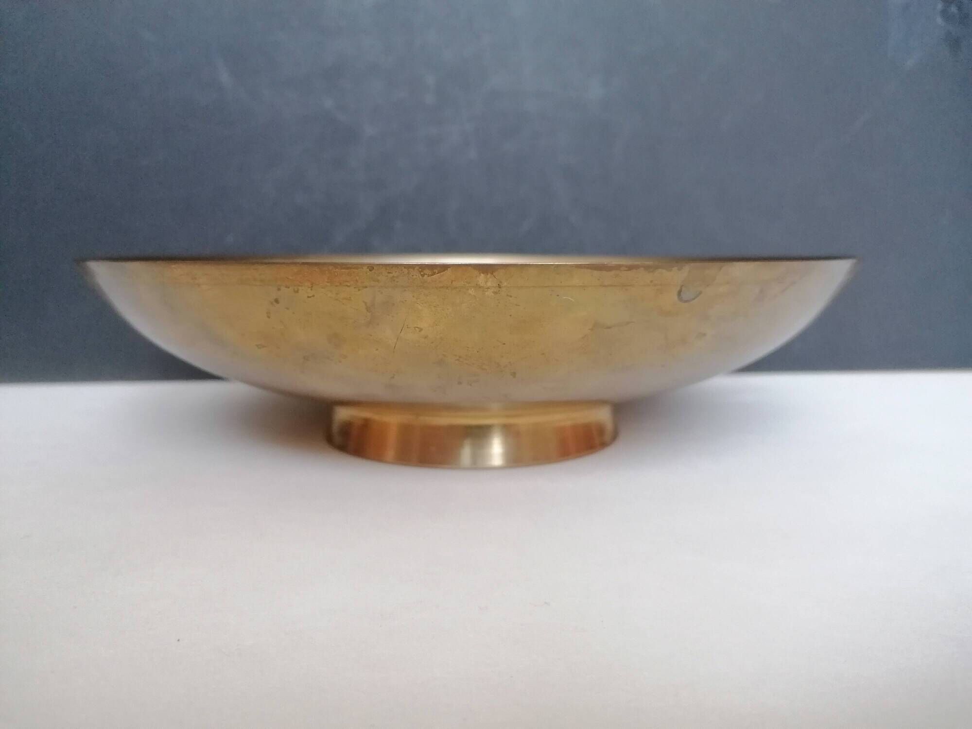 Enamelled brass stand with floral decoration.
