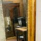 Louis XVI mirror in carved and gilded wood with leaf 18th century