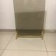 Fireplace screen in smoked glass and brass