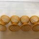 Four yellow spiral spring egg cups