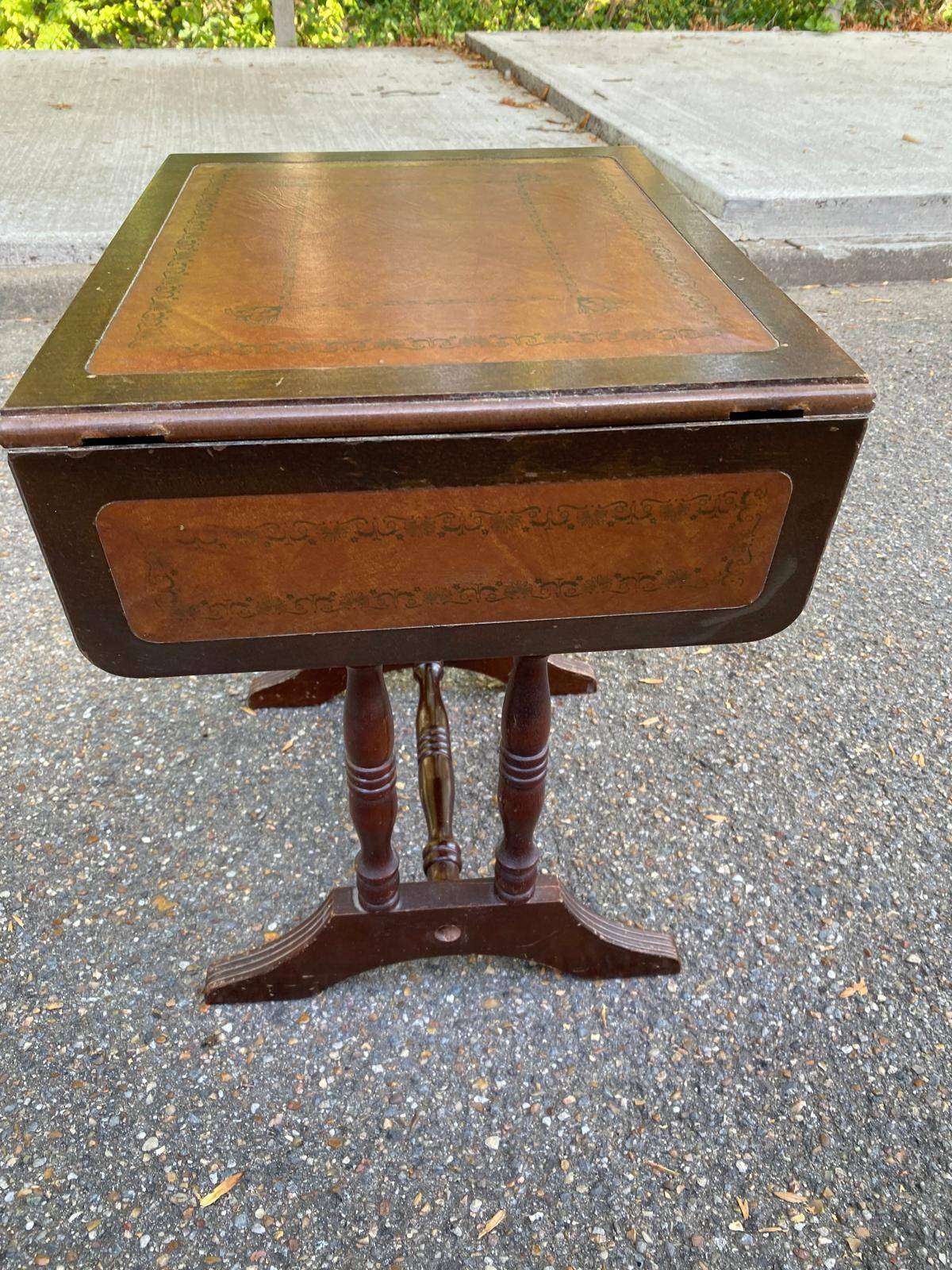 Small drop-leaf side table in English style with leather top & drawer.