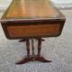 Small drop-leaf side table in English style with leather top & drawer.