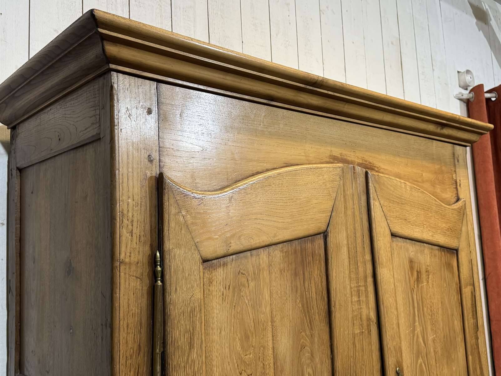 19th-century country wardrobe in blonde chestnut.