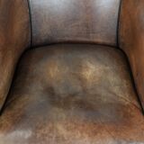Sturdy vintage sheepskin club armchair with a beautiful patina