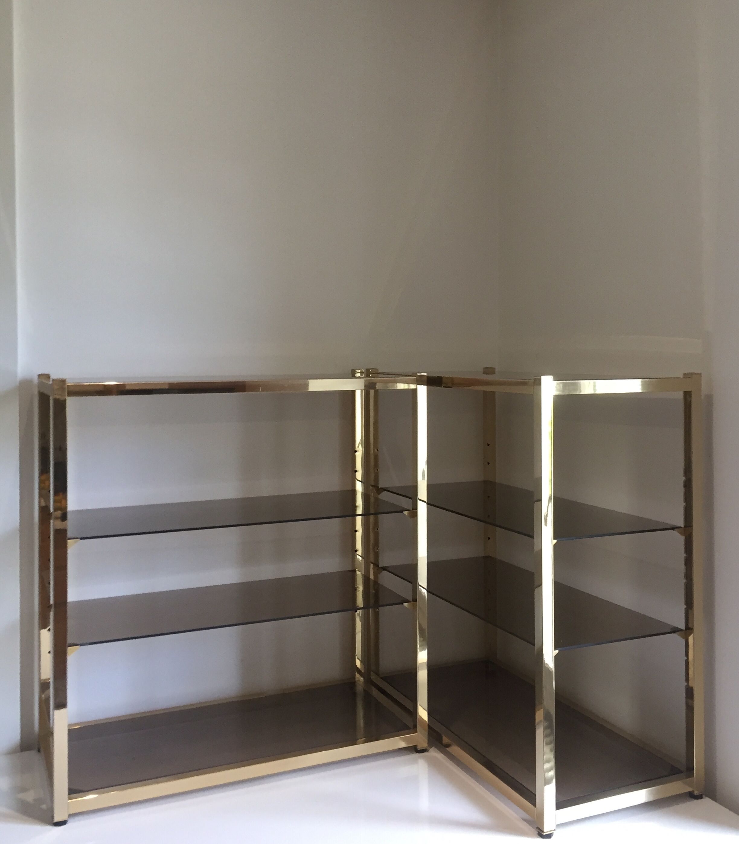 Pair of consoles brass shelves and smoked glass design Roche Bobois