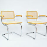 A pair of chairs with armrests, 1970s