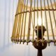Wooden table lamp in the shape of a bowling pin with a bamboo shade from the 1960s.