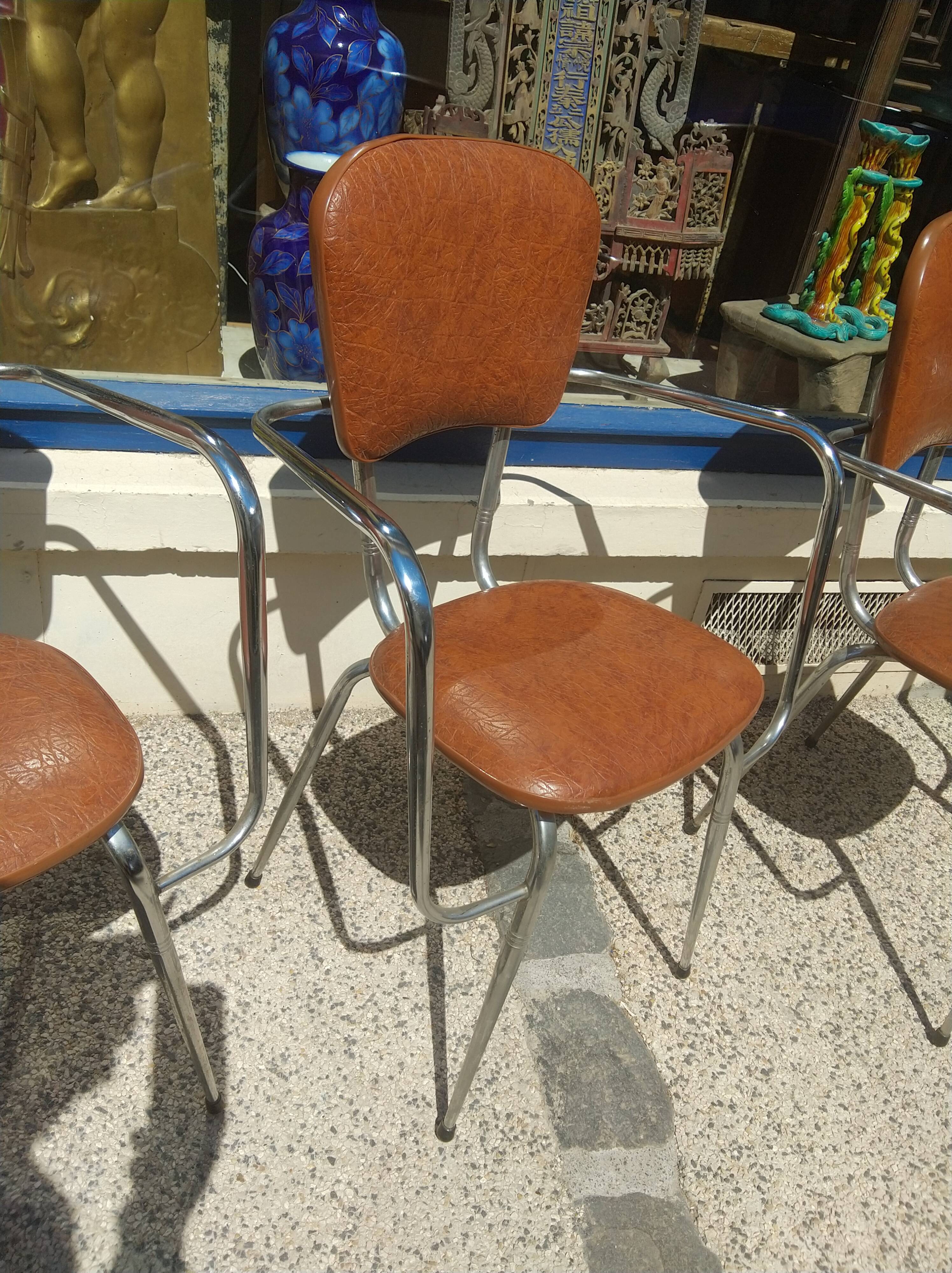 Set of 4 armchairs in chromed metal and brown imitation leather, circa 1960