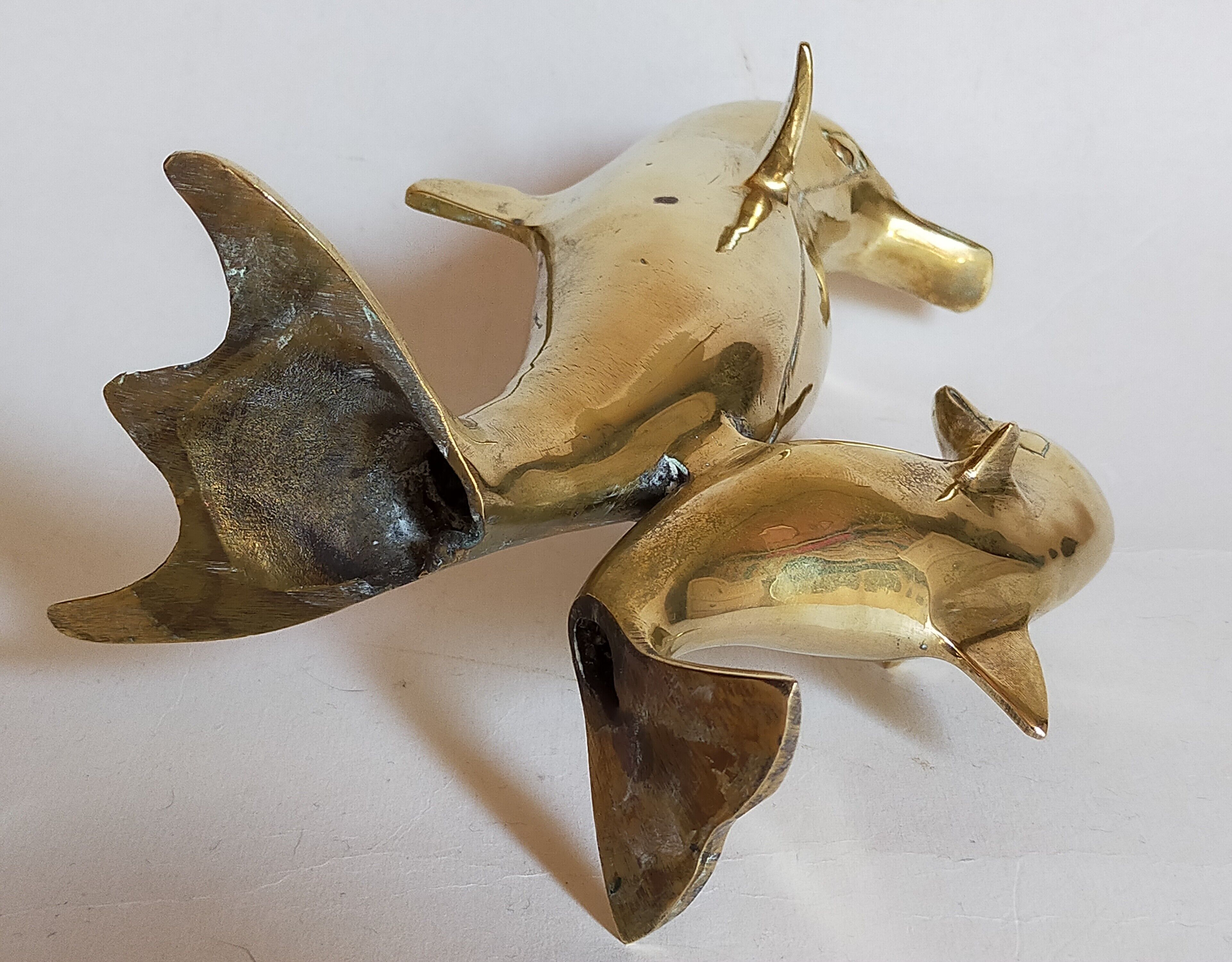 Vintage solid brass dolphins