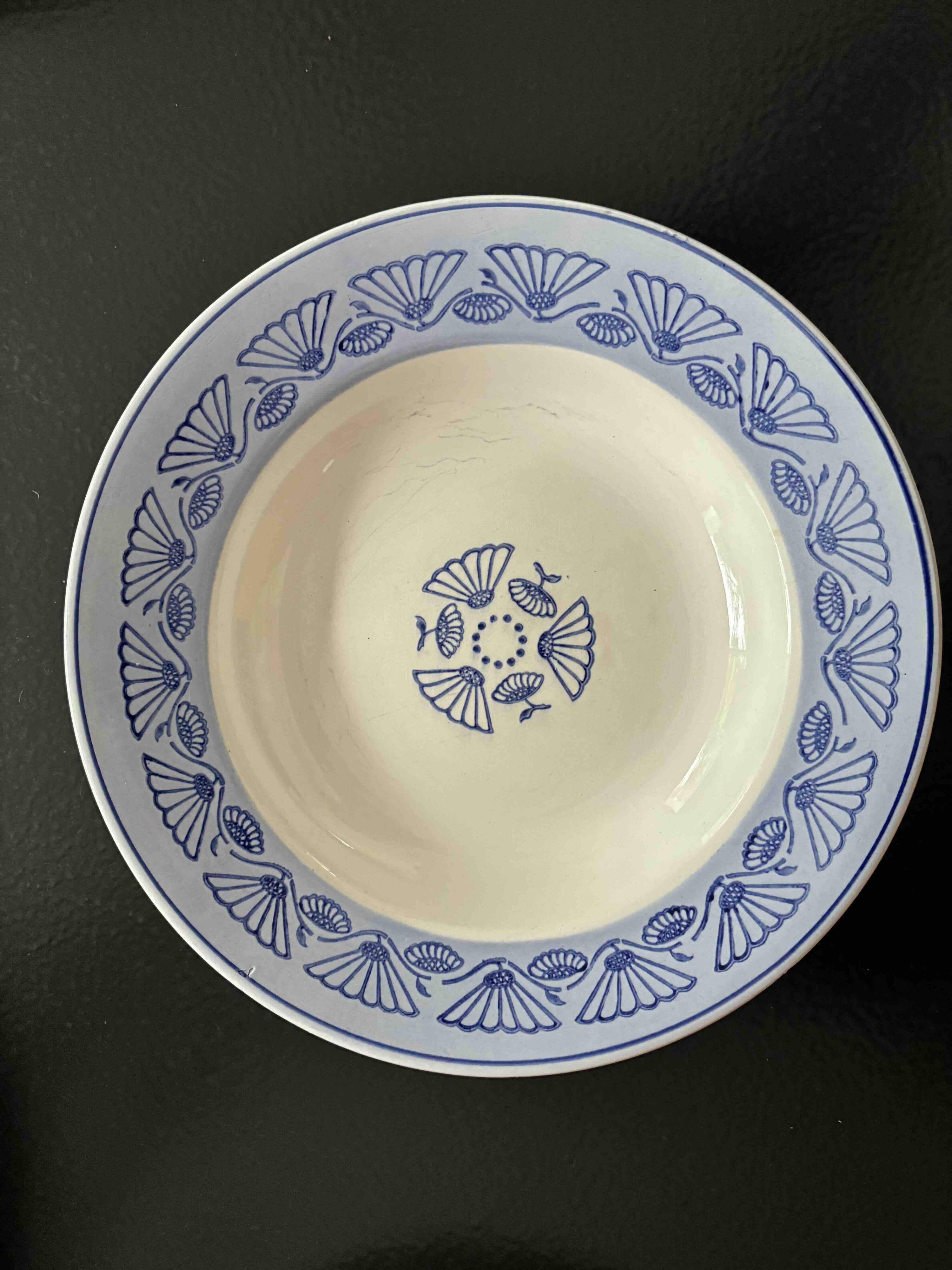 Set of 9 vintage deep plates with blue patterns.