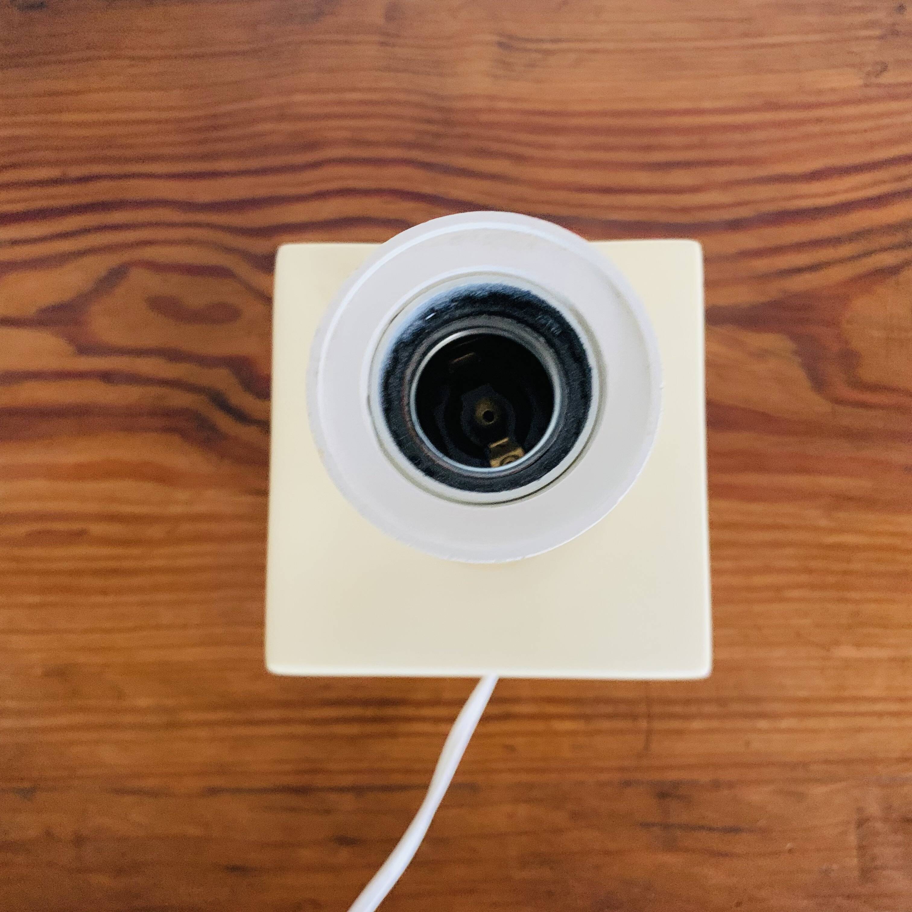 Lamp base representing a die