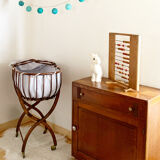 Vintage rattan cradle and its wheeled support