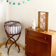 Vintage rattan cradle and its wheeled support