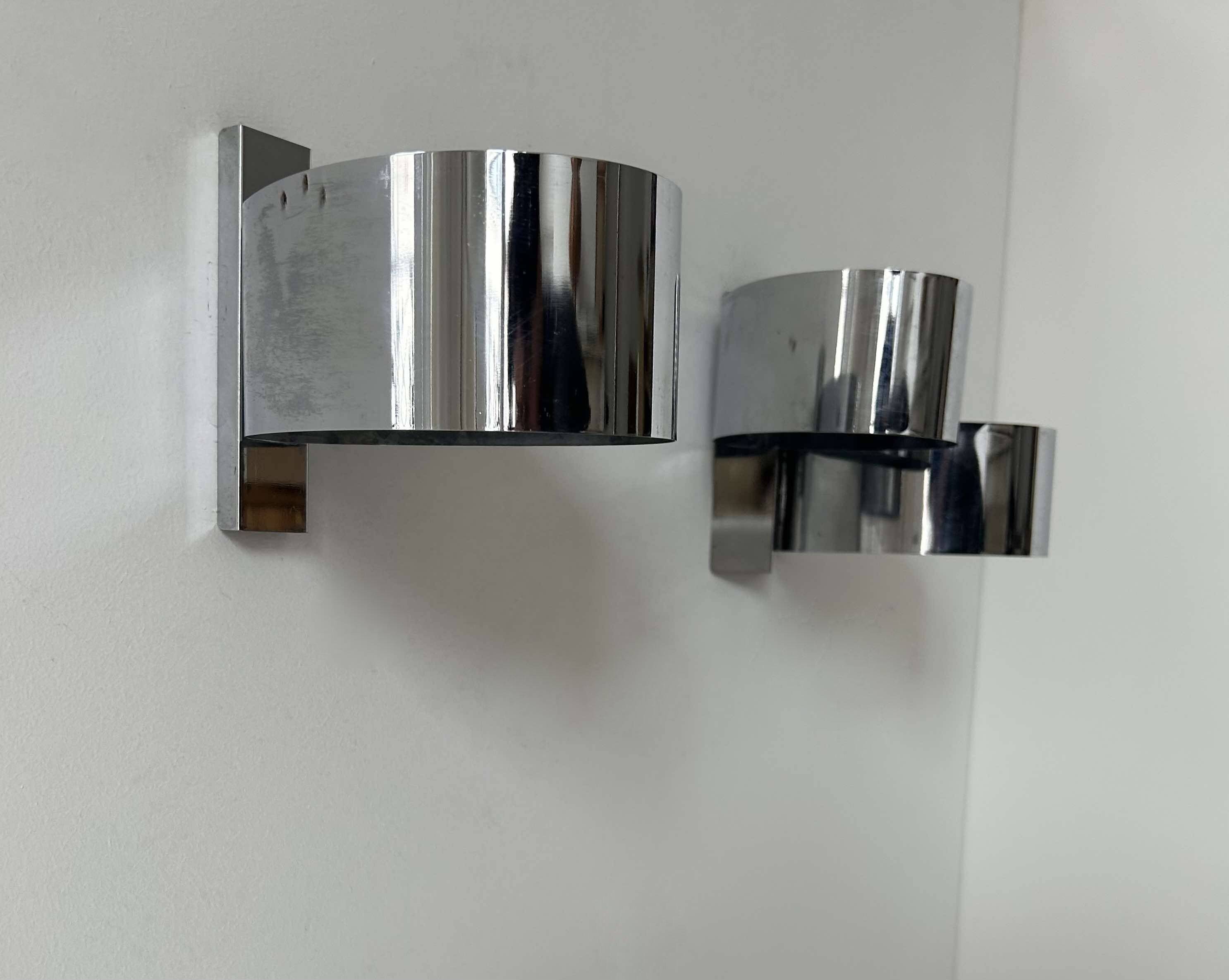 Pair of vintage wall lights, curved chrome metal, France 1970