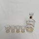 Liqueur carafe and its 4 small glasses