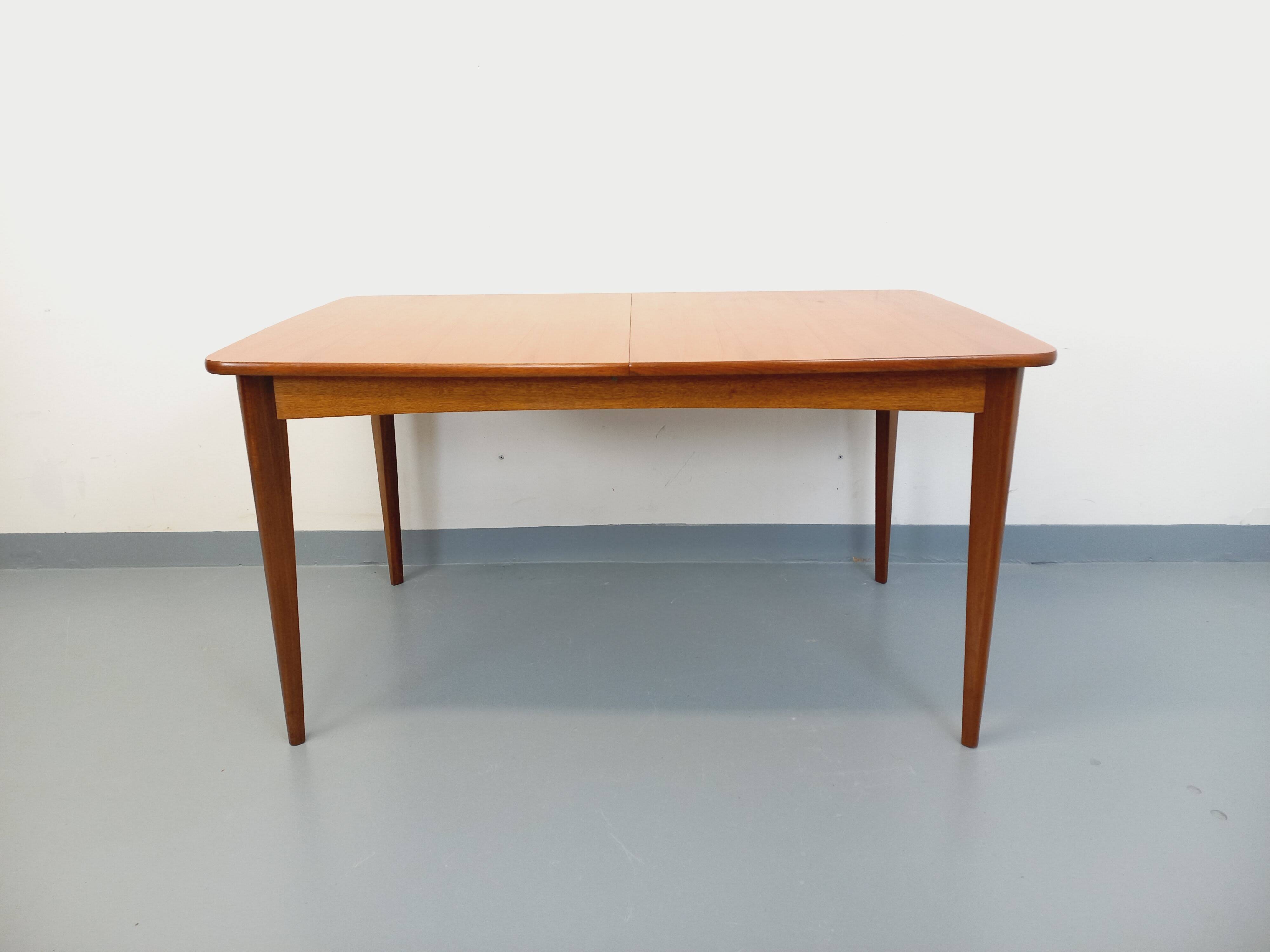 Rectangular dining table in vintage Scandinavian style from the 50s and 60s, made of teak.