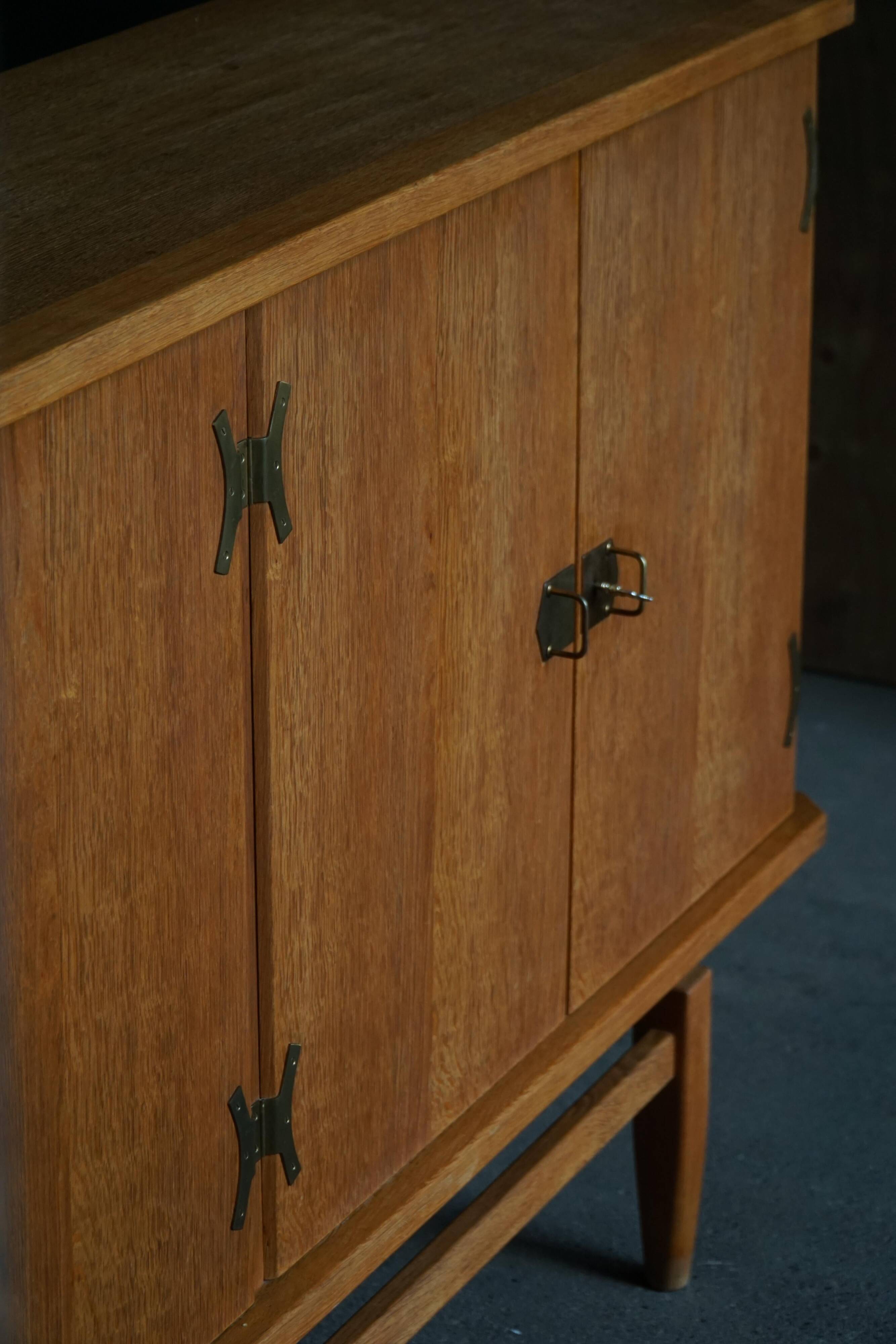 Oak and brass buffet by Henning Kjærnulf, Mid-century modern Danish, 1960s.