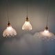 Trio of Art Deco scalloped clear glass pendant lights, 1920-30
