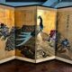 Ancient Chinese screen decorated with peacocks and flowers on gold leaf