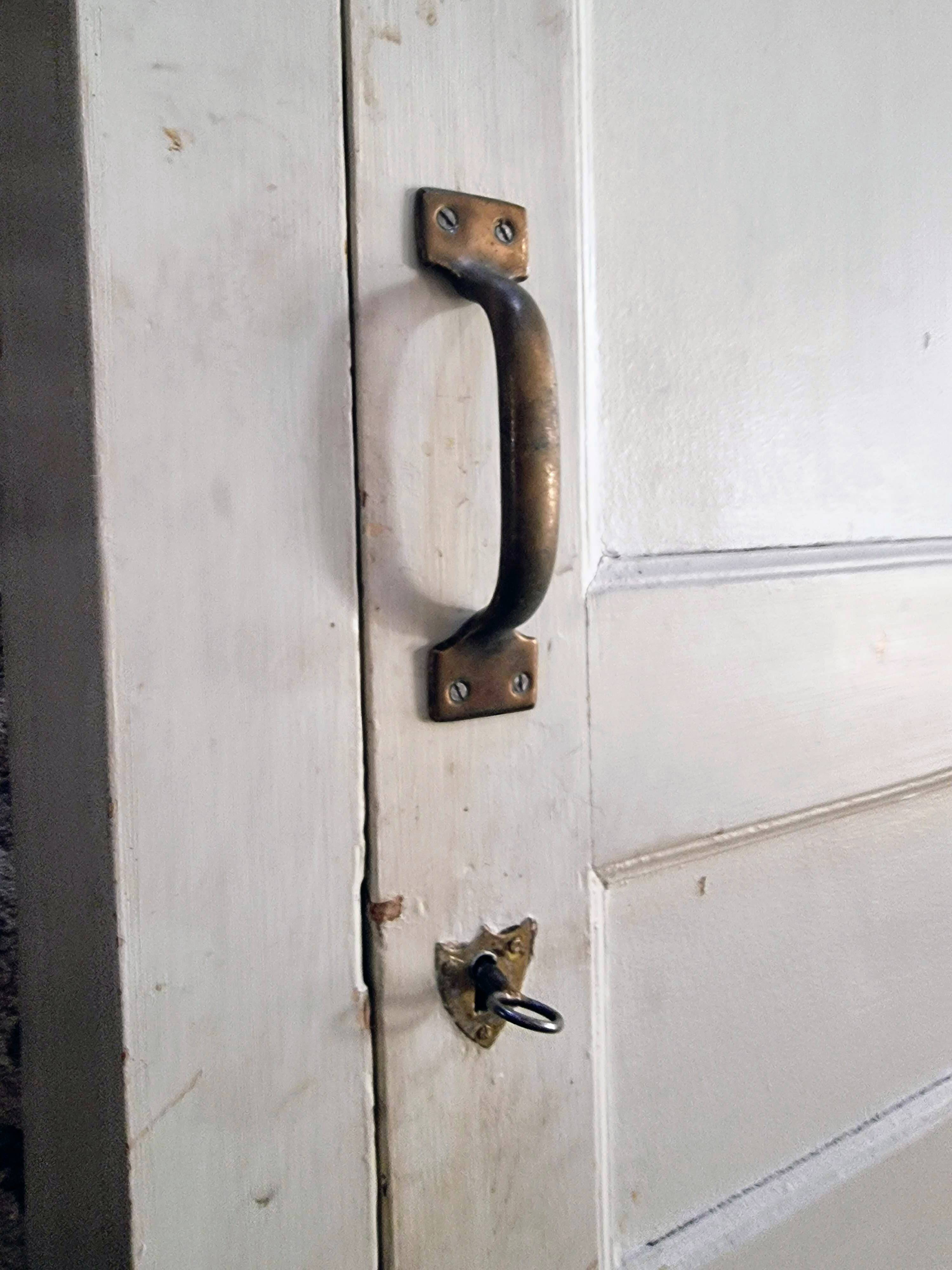 Antique French pine wardrobe with original white paint, circa 1900–1920.