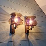 Pair of wall sconces in brass and smoked glass, 1960s.