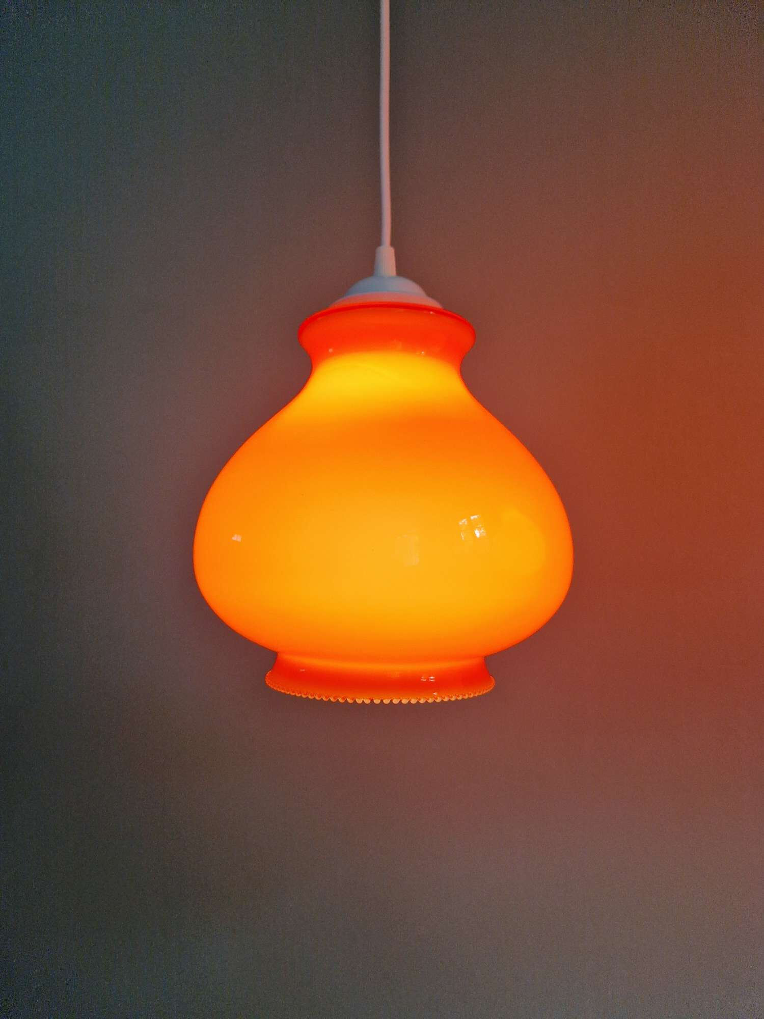 Trio of vintage orange opaline pendant lights, 1960-70
