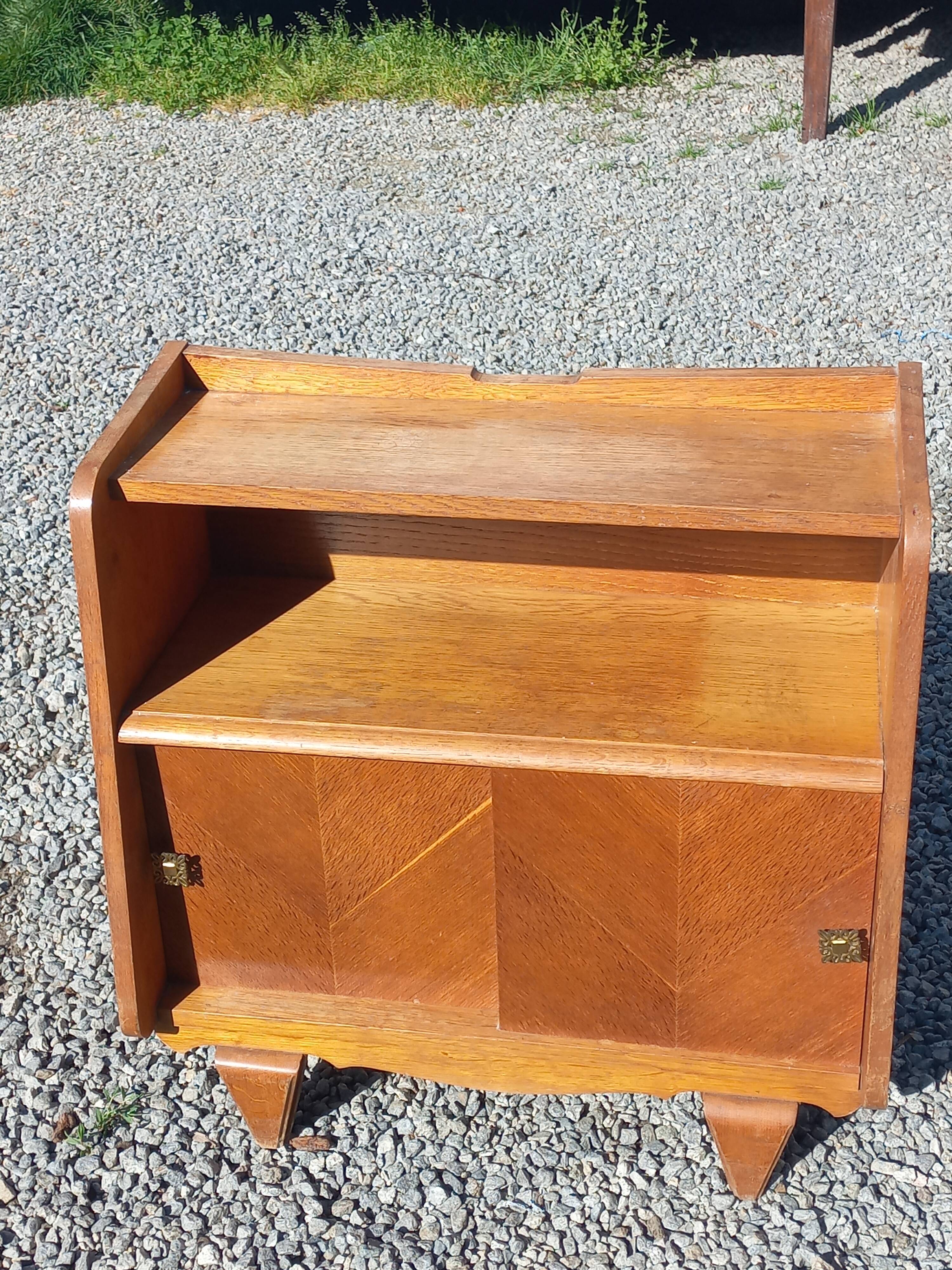Vintage accent furniture in golden blonde oak with 2 sliding doors.