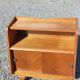 Vintage accent furniture in golden blonde oak with 2 sliding doors.