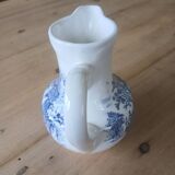 Small old pitcher in iron earth