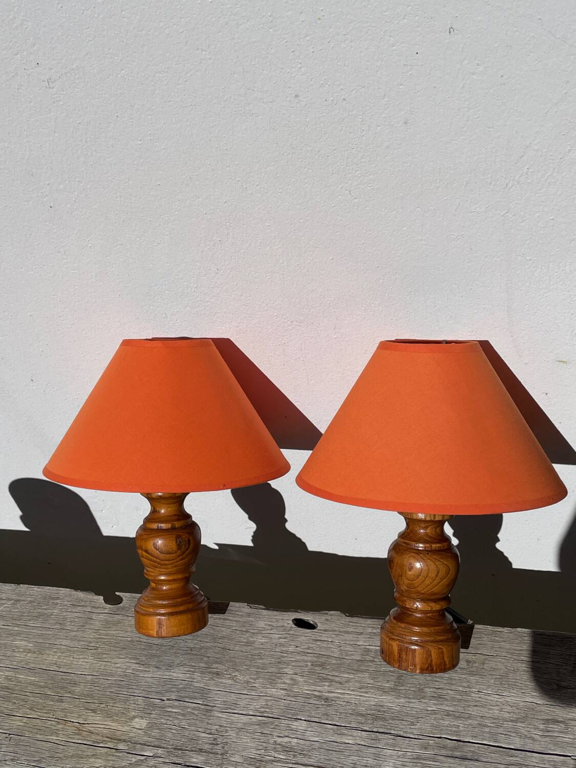 Pair of orange turned wood lamps